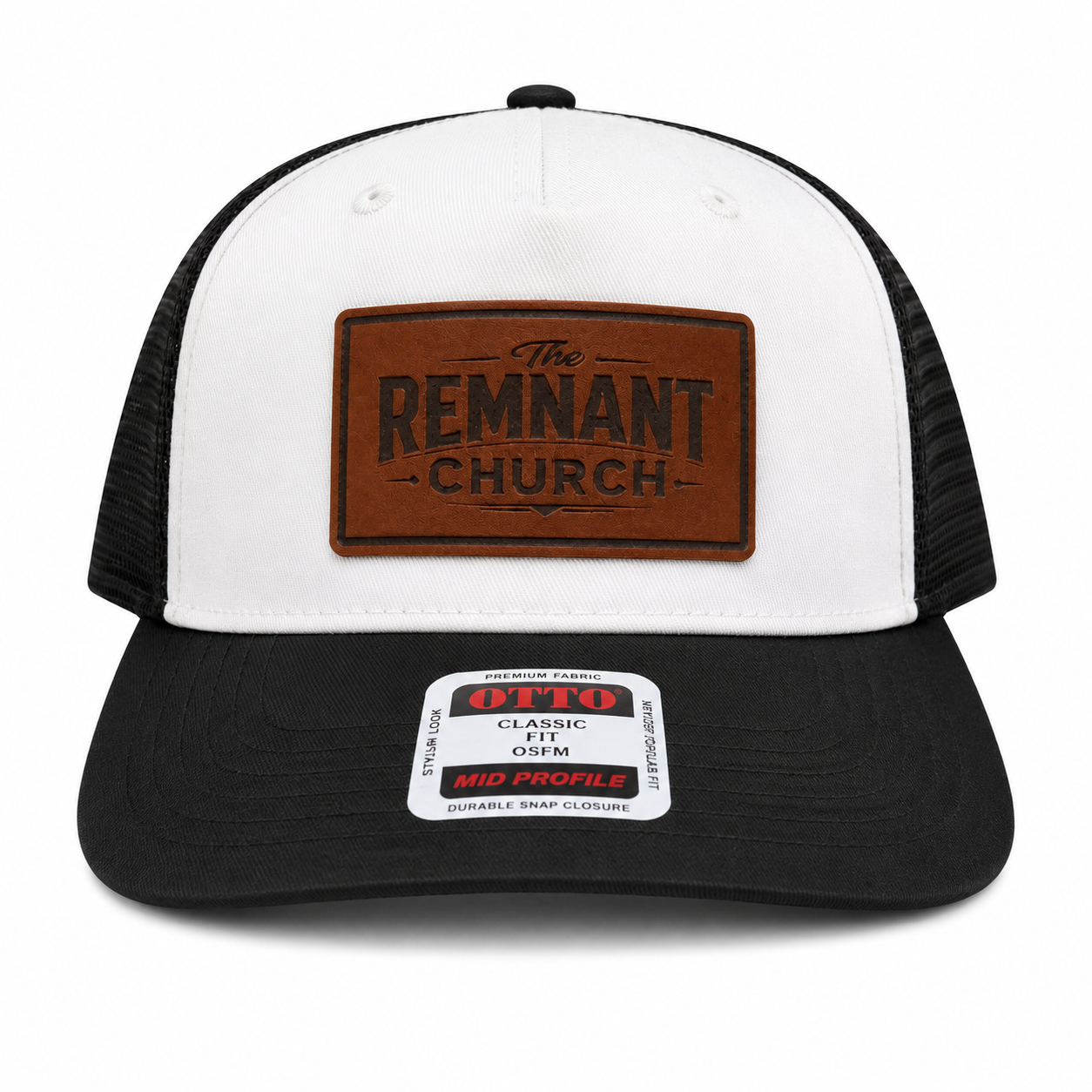 White and black trucker hat with brown leather patch and label on a white background